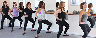 Standing at the barre bending knees