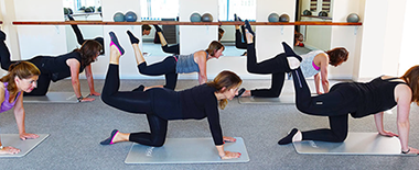 Leg lifting exercise on floor mats